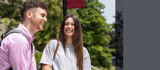 Saint Joseph's University students talking to one another and smiling