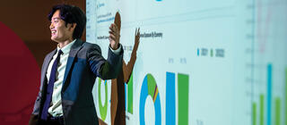A business students presents data visualizations and analysis