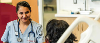 Student in nursing program speaking with a patient