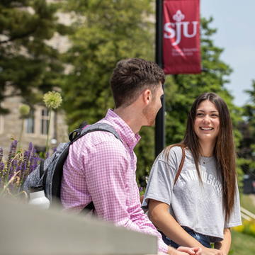 Saint Joseph's University students talking to one another